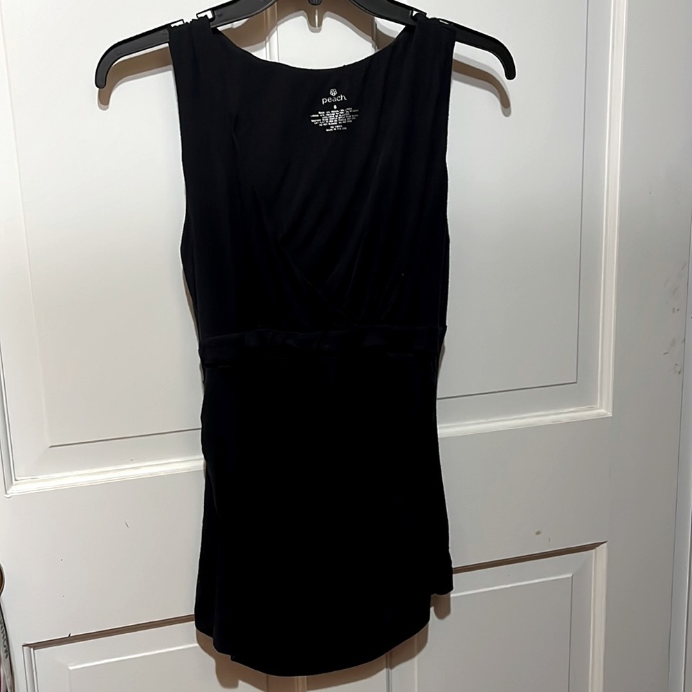 Black neck low cut blouse made of soft Modal fabric.